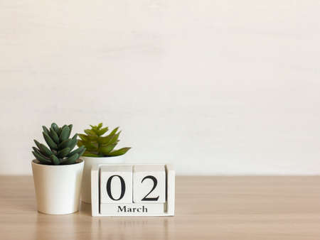 March 2 on a wooden calendar on a light background. Spring is in the yard.の写真素材