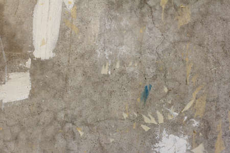 Concrete wall .Abstract textured concrete gray background.The cracks and the remains of the Wallpaper.Repairs in the apartment or office.の写真素材