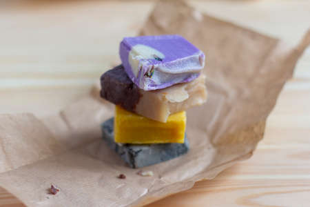 Natural handmade soap. Pieces of multicolored soap made of natural materials on the table