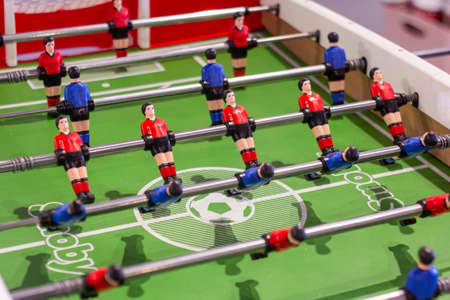Table football in the entertainment center. Close-up of toy players on the football fieldの写真素材