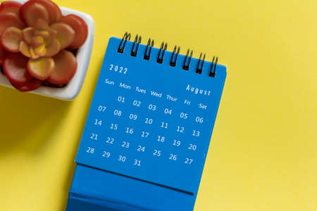Desktop calendar for December 2022 on a yellow backgroundの写真素材