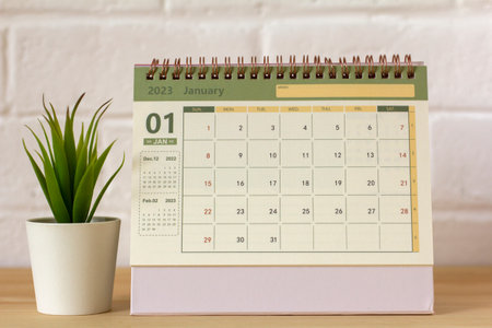 Hello January.The calendar for January 2023 is on the tableの写真素材