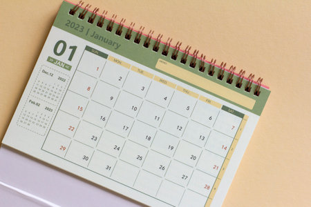 Hello January.The calendar for January 2023 is on the tableの写真素材