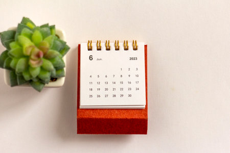 Desktop calendar for June 2023 on a light backgroundの写真素材