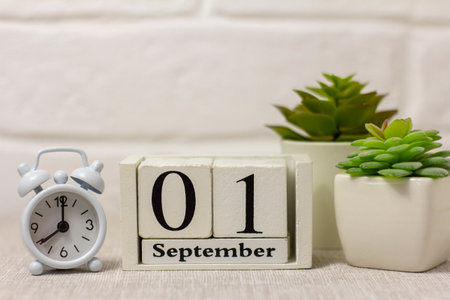 September 1 in a wooden calendar on a table or shelf.Back to school .Calendar for September. Autumn