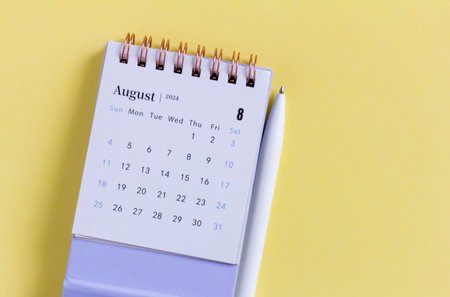August 2024 Monthly Desk Calendar on Desktop. Copy Space