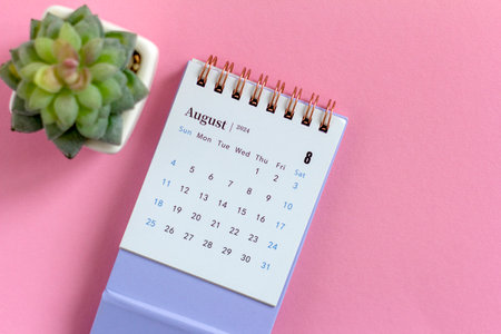 Calendar for August 2024 on a pink backgroundの写真素材