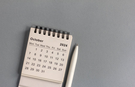 Desk calendar for October 2024 on a gray backgroundの写真素材