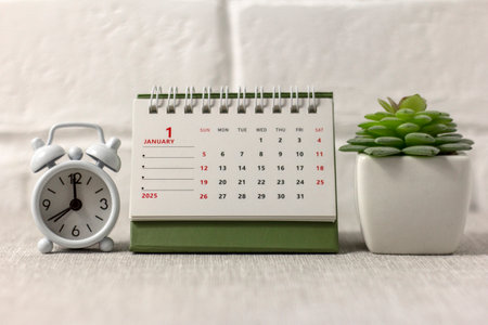 Hello, 2025. January calendar for planning on the table