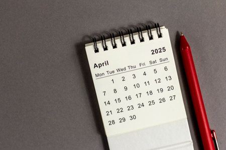 Desk calendar for April 2025 for planning on gray backgroundの写真素材