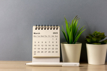 March 2025 on the table. Desk calendar for planning and organizing timeの写真素材