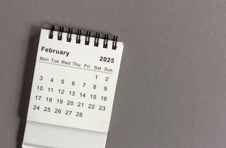 Hello February. February 2025 planning calendar on a gray backgroundの写真素材