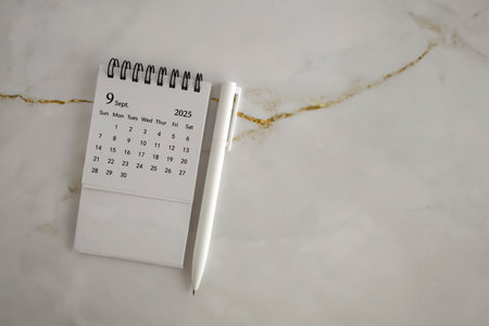 Hello, September 2025. Desktop calendar for planning on an abstract background