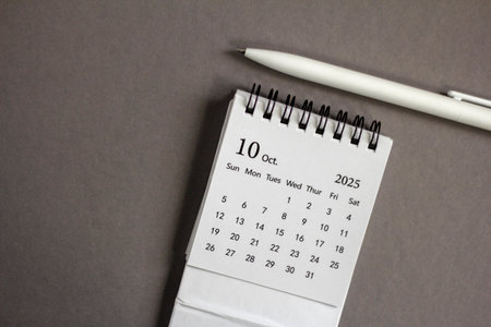 Hello, October 2025. Desktop calendar for planning on a gray background