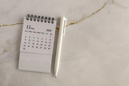 Hello, November 2025. Desktop calendar for planning on an abstract background