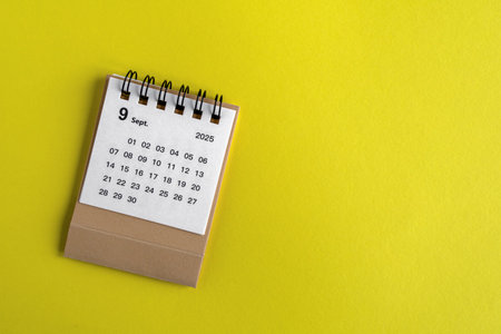 September 2025. Desktop calendar for planning on a yellow background.Hello autumn