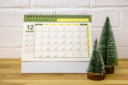 December 2025. A desktop calendar for planning on the tableの写真素材