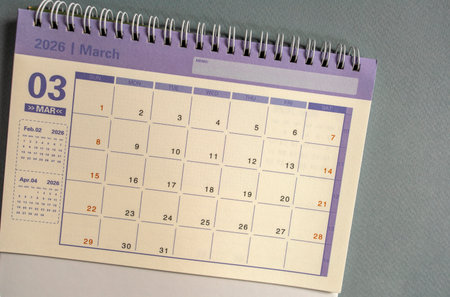 Desktop calendar for March 2026 on a gray backgroundの写真素材