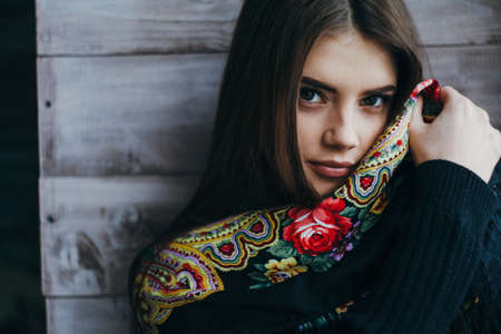 Beautiful young woman wearing scarfの写真素材