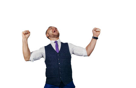 young businessman rejoices victory, stylish , white backgroundの写真素材