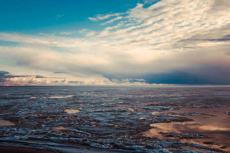 Beautiful decline at the frozen sea.の写真素材