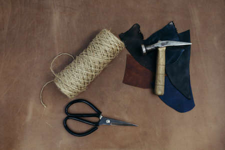 Tools pattern. Hammer, scissors in leather. Background with sewing and knitting tools and accesoriesの写真素材