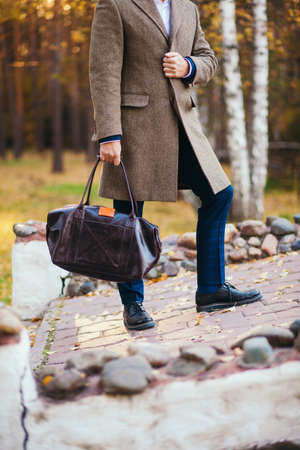 Busy man walking on street with briefcaseの写真素材