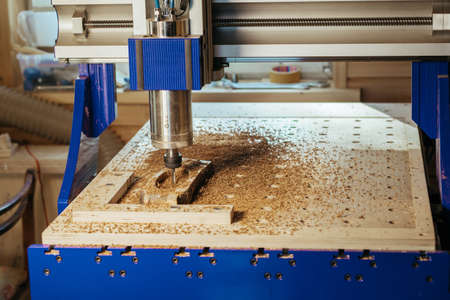 Machine tool in wood factory with drilling cnc machines. Computer numerical controlの写真素材