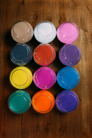 ollection of decorative candles on a rustic antique wooden backgroundの写真素材