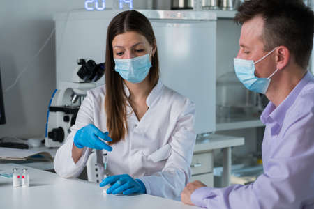 Man with face mask getting vaccinated, virus and vaccination concept.