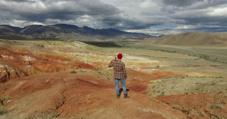 Altai. Red mountains. The photographer takes the picture of a mountain landscapeの写真素材