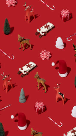 Minimal composition pattern with various winter and New Year objects on bright red background. Christmas concept.の写真素材