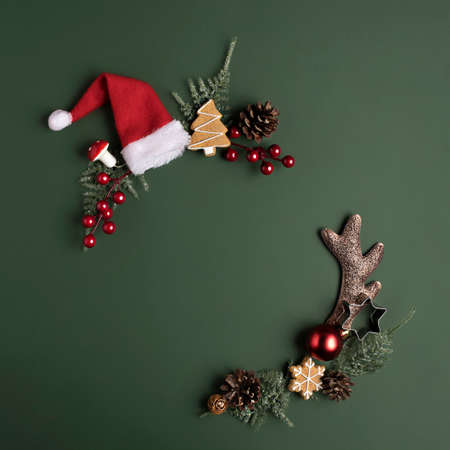 Christmas holiday background with copy space for text. Flat lay, top view. Decorative wreath frame...