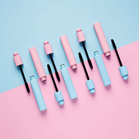 Set of professional mascara on pastel pink and blue background with copy space for text. Minimal make up, beauty, fashion, party and shopping concept. Cosmetic or beauty salon layout. Flat lay.の写真素材