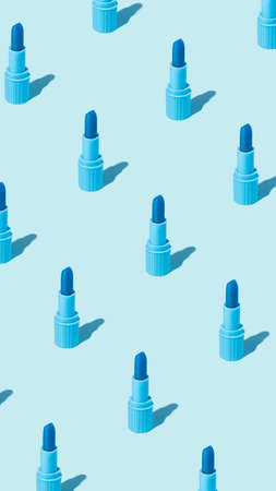Creative pattern layout made with blue lipstick on pastel blue background. Minimal make up artist,...
