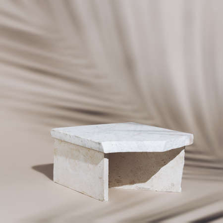Luxury podium with palm leaf shadow and marble stone on beige background. Concept scene stage showcase for product, promotion, sale, presentation or cosmetic. Minimal showcase empty mock up template.の写真素材