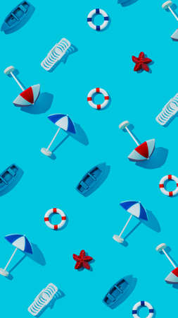 Summer pattern made with beach chair, life saver float, sun umbrellas and boats on vibrant blue background. Creative vacation texture concept. Trendy minimal sea flat lay composition.の写真素材
