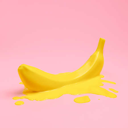 Melting banana in yellow paint puddle isolated on a pastel pink background. Creative food concept. Summer tropical  fruit diet composition. Pop art aesthetic.の写真素材