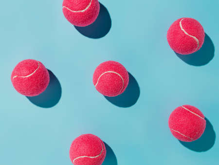 Tennis balls pattern on blue background. Flat lay, top viewの写真素材