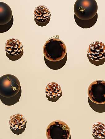 Seamless pattern of Christmas balls and pine cones on a beige background.の写真素材
