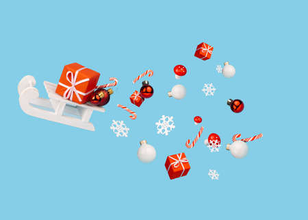 Christmas night scene with sleigh flying with trail of snowflakes, gifts and ornaments on blue sky...