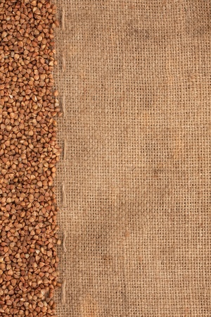 buckwheat lying on sackcloth can use as backgroundの写真素材