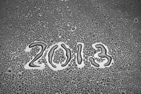 Inscription from 2013 written on a black background with water