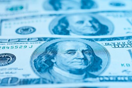 Closeup of a $100 banknotes in blue lightの写真素材