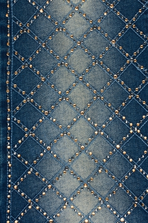 Light-blue denim with yellow and silver rhinestones, backgroundの写真素材