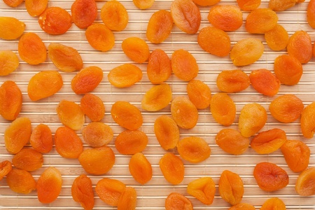 Apricots on the bamboo mat, can be used as backgroundの写真素材