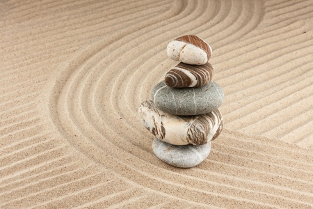 Pyramid made of  stones standing on the sandの写真素材