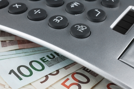 Calculator lying on the euro, can be used as backgroundの写真素材