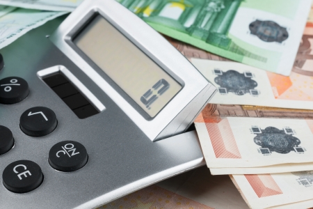 Calculator lying on the euro, can be used as backgroundの写真素材