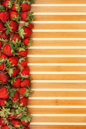 Strawberries lying on the mat as backgroundの写真素材